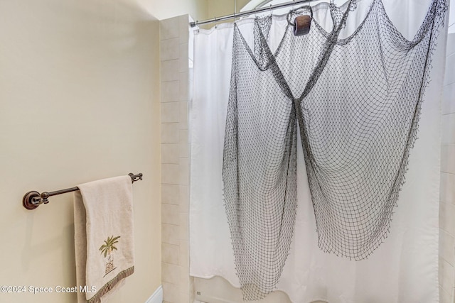 full bath with a shower with shower curtain