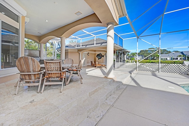 view of patio with glass enclosure