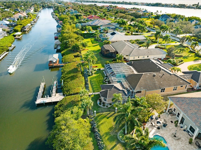 birds eye view of property featuring a water view and a residential view