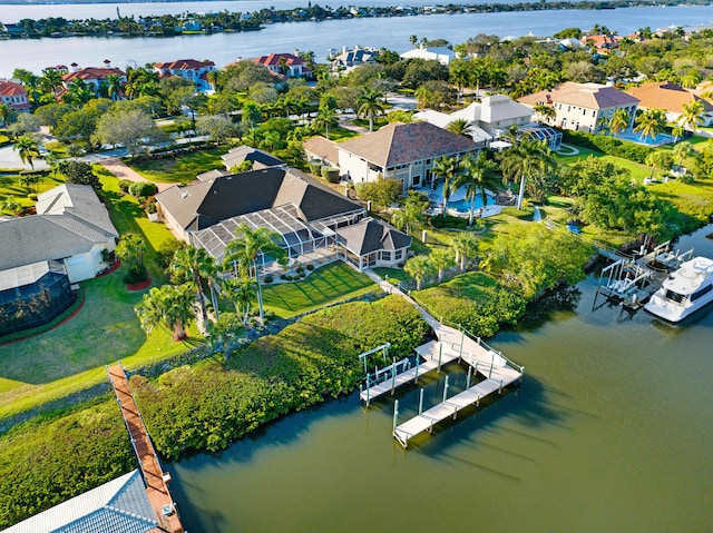 bird's eye view featuring a water view and a residential view