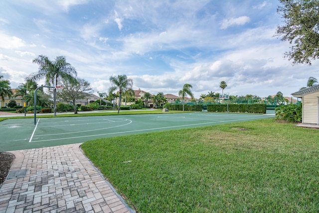 view of basketball court featuring a yard