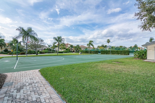 view of sport court featuring a lawn and community basketball court
