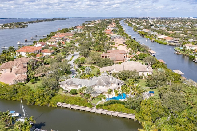 drone / aerial view with a residential view and a water view