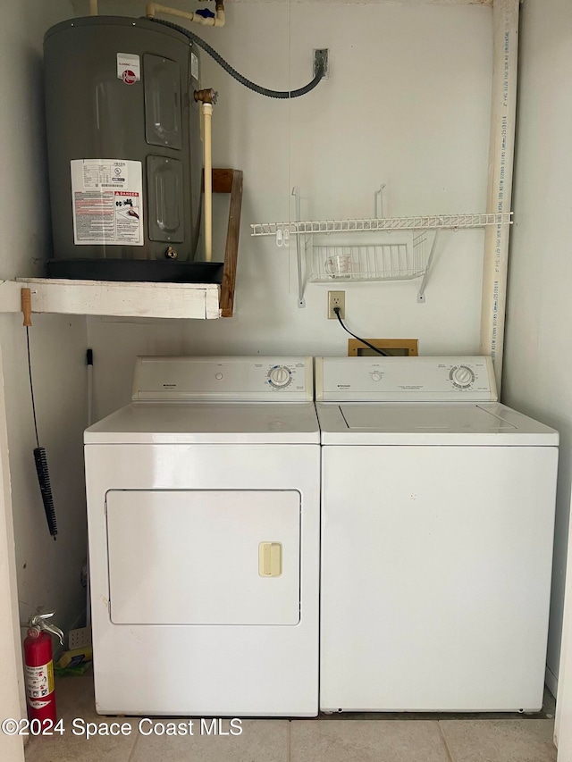 laundry area featuring separate washer and dryer and electric water heater