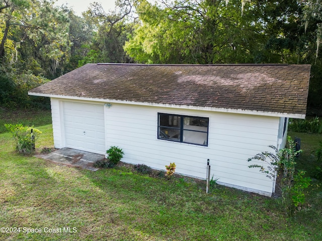 garage with a yard