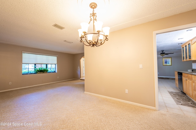 unfurnished room with light carpet, ceiling fan with notable chandelier, and a textured ceiling