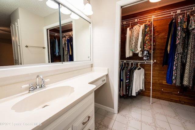 bathroom featuring vanity and a textured ceiling