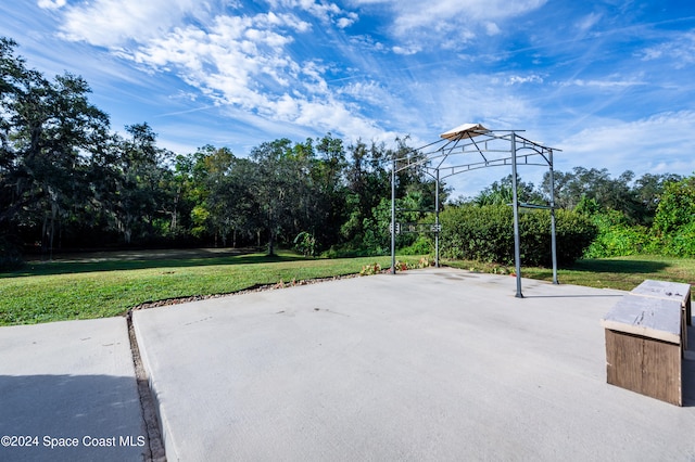 view of patio with basketball hoop