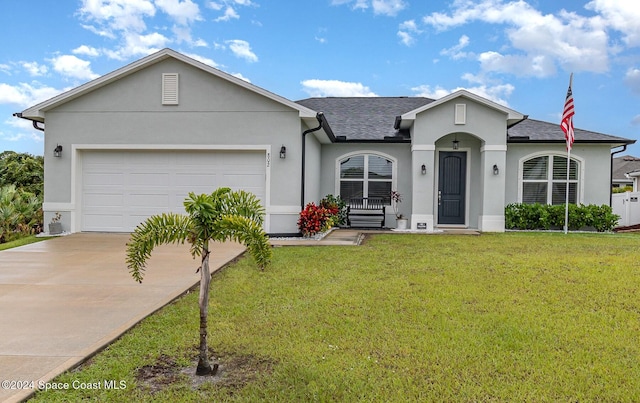 single story home featuring a front lawn and a garage