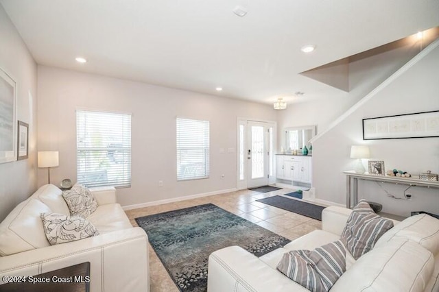 living room featuring light tile patterned floors, plenty of natural light, recessed lighting, and baseboards