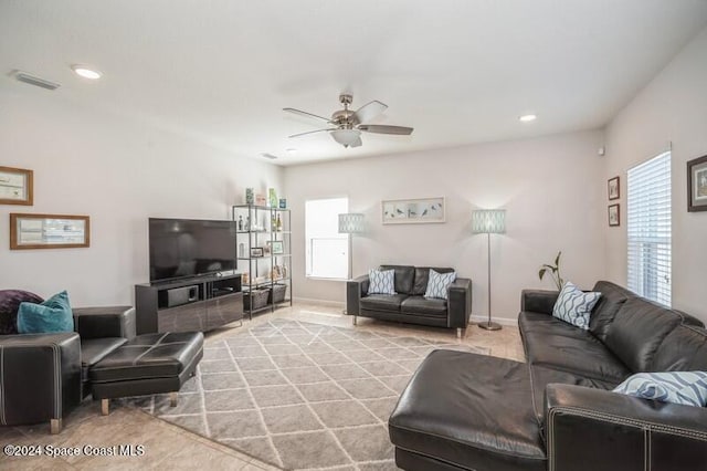 living room featuring a wealth of natural light, visible vents, recessed lighting, and a ceiling fan