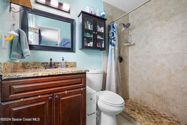 bathroom with vanity, a shower with curtain, and toilet