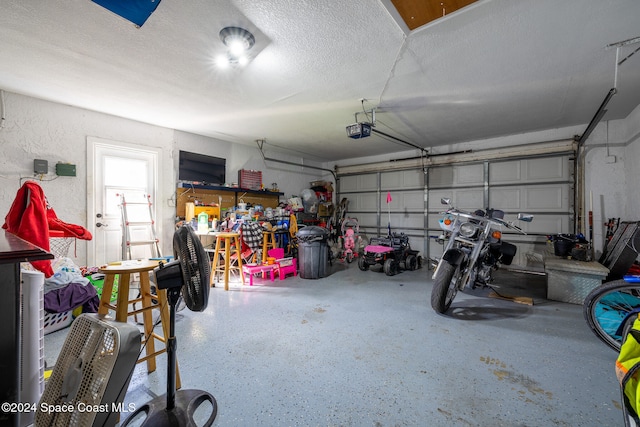 garage featuring a garage door opener