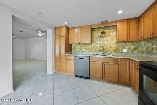 kitchen with decorative backsplash, black electric range, ceiling fan, sink, and dishwasher