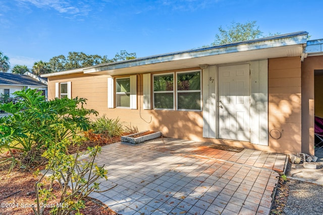 back of property with a patio area