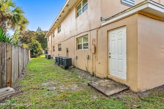 view of side of home with cooling unit