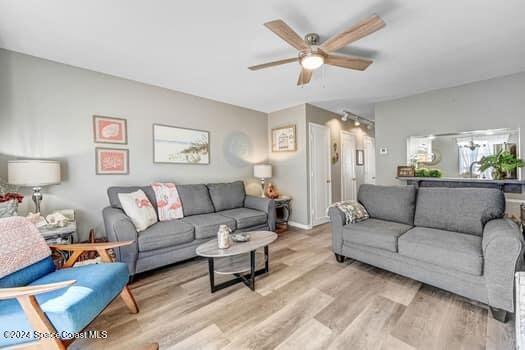 927 Jamestown Ave # 105, Indian Harbour Beach, FL 32937 - living area featuring wood finished floors and a ceiling fan