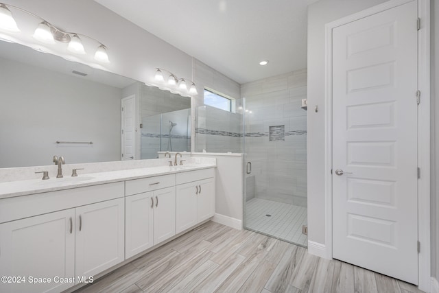 bathroom with vanity and an enclosed shower