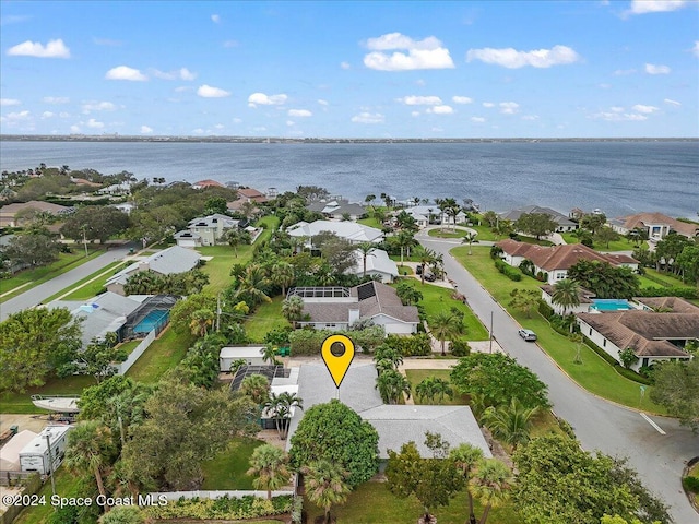 birds eye view of property featuring a water view