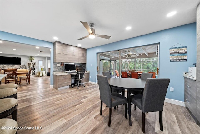 dining room featuring light hardwood / wood-style flooring and ceiling fan