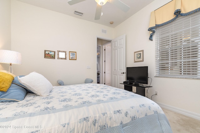 bedroom featuring ceiling fan and light carpet