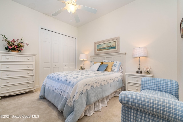 bedroom with light carpet, a closet, and ceiling fan