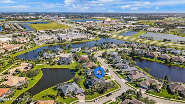 drone / aerial view with a water view