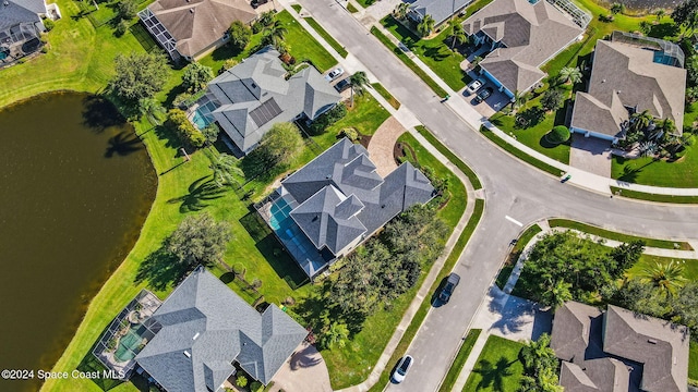 birds eye view of property with a water view