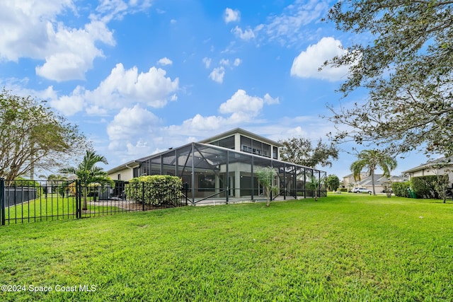 view of yard featuring glass enclosure