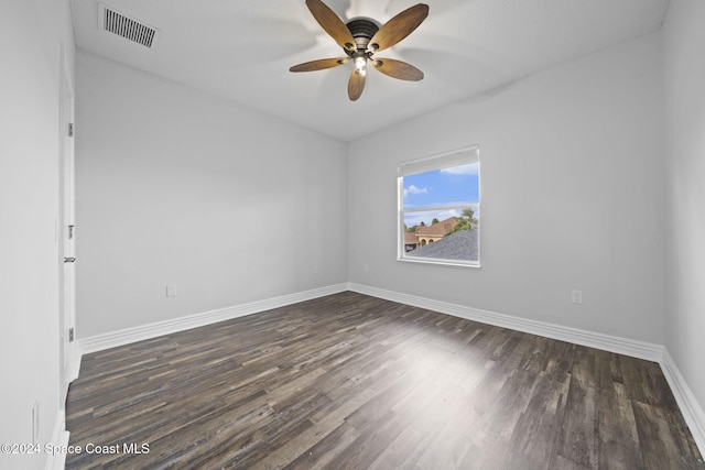 unfurnished room with ceiling fan and dark hardwood / wood-style floors