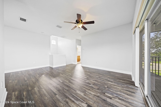 spare room featuring ceiling fan and dark hardwood / wood-style flooring