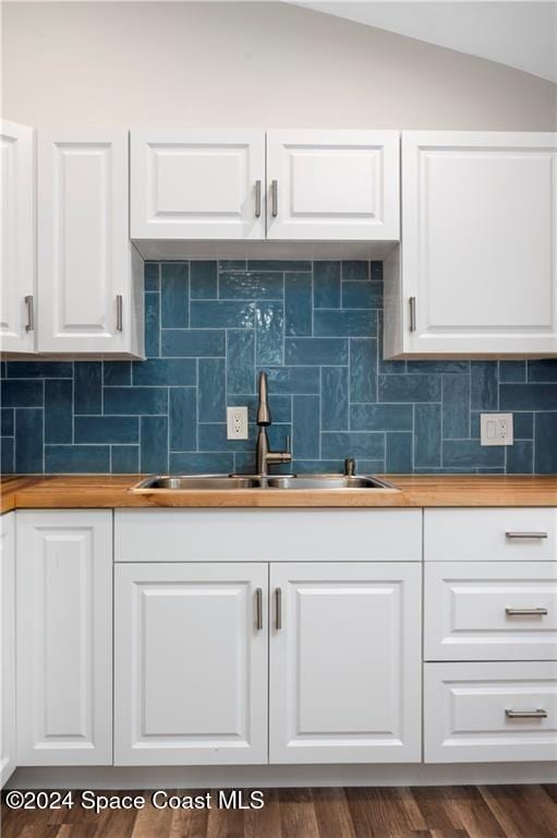 kitchen with white cabinetry, wooden counters, and dark wood-type flooring