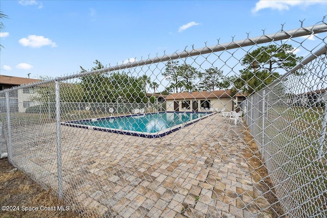 view of swimming pool with a patio area