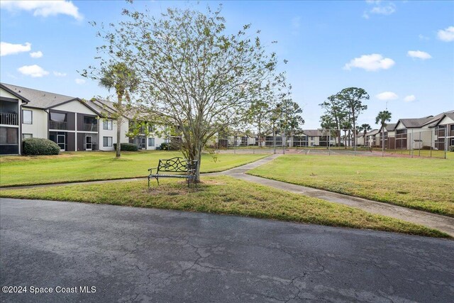 view of home's community featuring a lawn