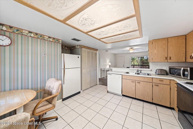 kitchen featuring light tile patterned floors, white appliances, ceiling fan, and sink