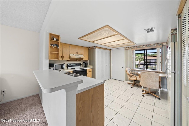 kitchen with sink, light tile patterned floors, a textured ceiling, kitchen peninsula, and stainless steel appliances