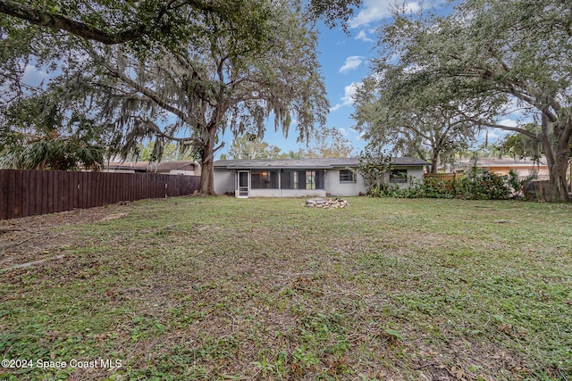 view of yard featuring a sunroom