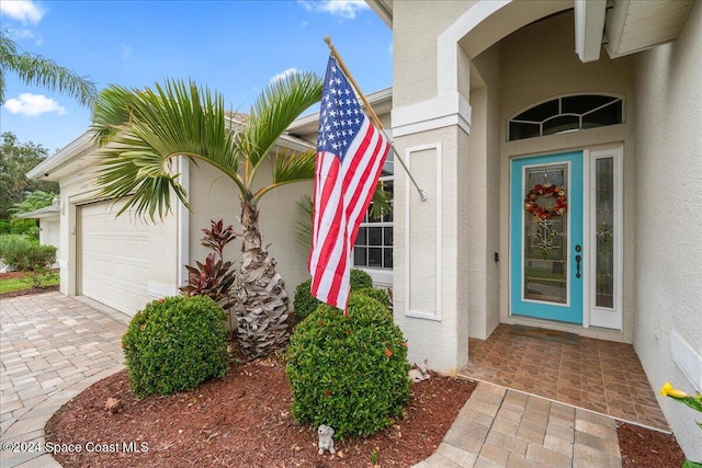 doorway to property featuring a garage