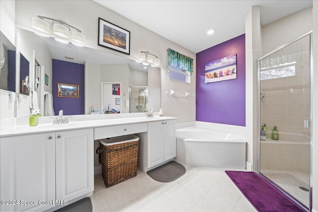 bathroom with vanity, shower with separate bathtub, and tile patterned floors