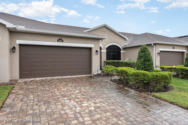 single story home with a garage