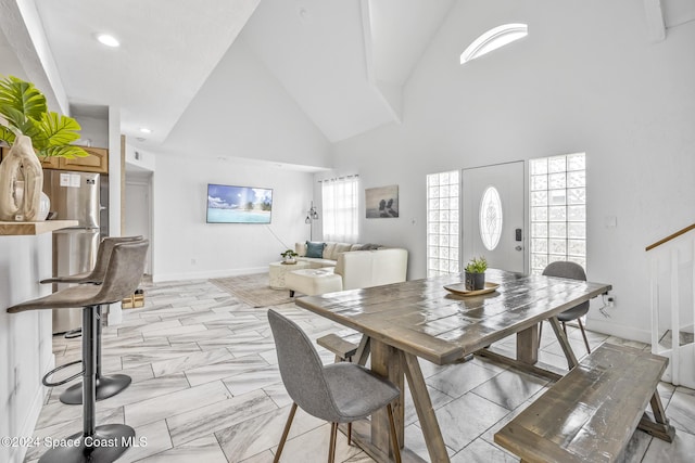3524 S Atlantic Ave, Cocoa Beach, FL 32931 - dining room with high vaulted ceiling, baseboards, recessed lighting, and stairway