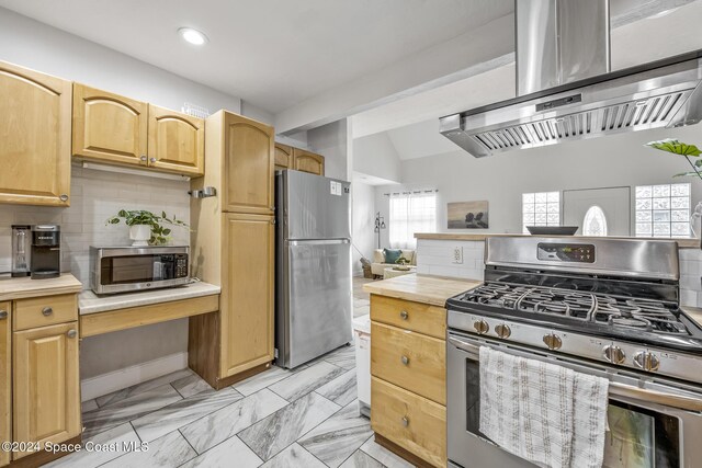 3524 S Atlantic Ave, Cocoa Beach, FL 32931 - kitchen featuring appliances with stainless steel finishes, exhaust hood, recessed lighting, backsplash, and vaulted ceiling