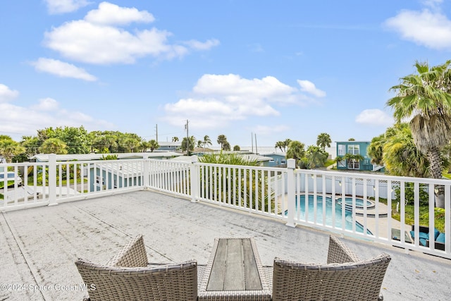3524 S Atlantic Ave, Cocoa Beach, FL 32931 - view of patio / terrace featuring a pool with connected hot tub