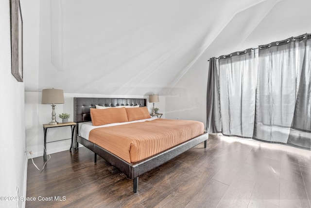 3524 S Atlantic Ave, Cocoa Beach, FL 32931 - bedroom featuring lofted ceiling and wood finished floors