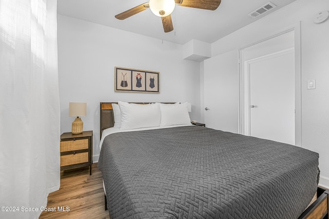 3524 S Atlantic Ave, Cocoa Beach, FL 32931 - bedroom featuring wood finished floors and a ceiling fan
