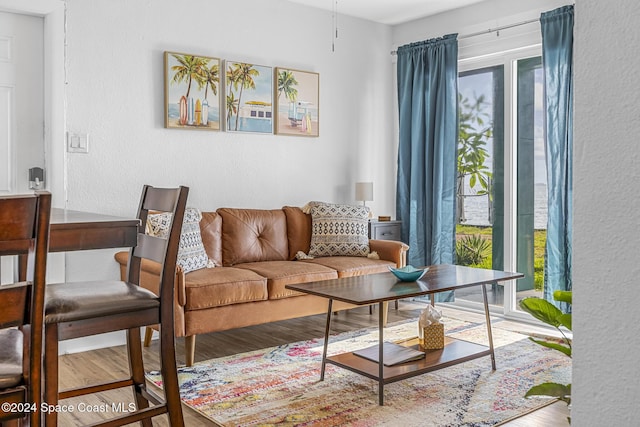 3524 S Atlantic Ave, Cocoa Beach, FL 32931 - living area featuring a textured wall and wood finished floors
