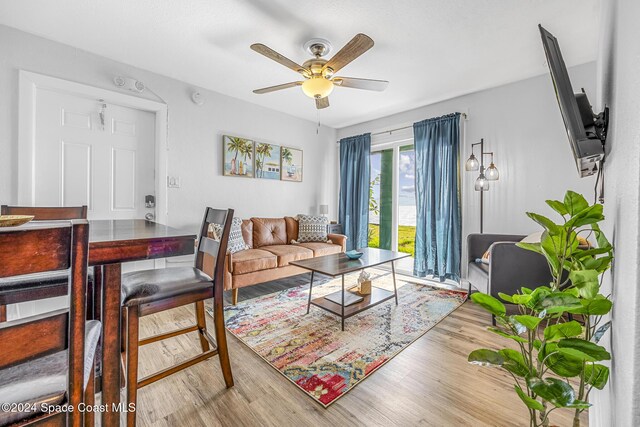 3524 S Atlantic Ave, Cocoa Beach, FL 32931 - living area with ceiling fan and wood finished floors