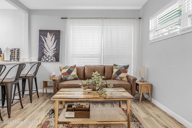 3524 S Atlantic Ave, Cocoa Beach, FL 32931 - living room with light wood-style floors and baseboards