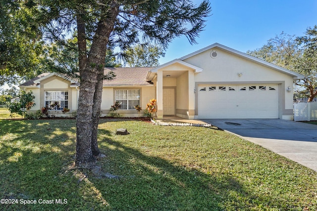 single story home featuring a front yard and a garage