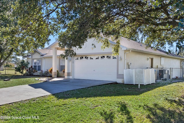 ranch-style home featuring a garage and a front lawn